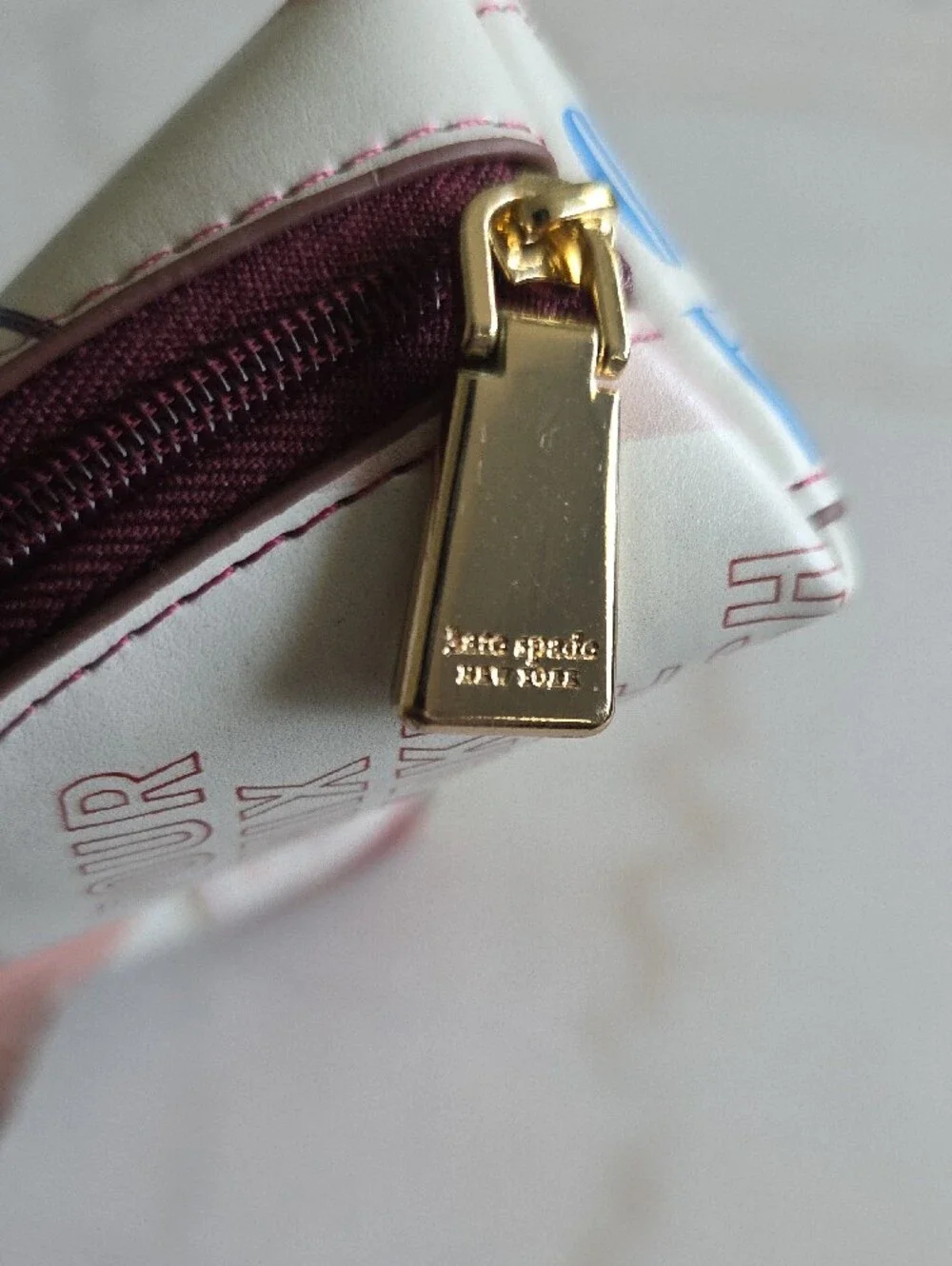 kate spade multicolor printed pencil case in cream, blue, green and burgundy
